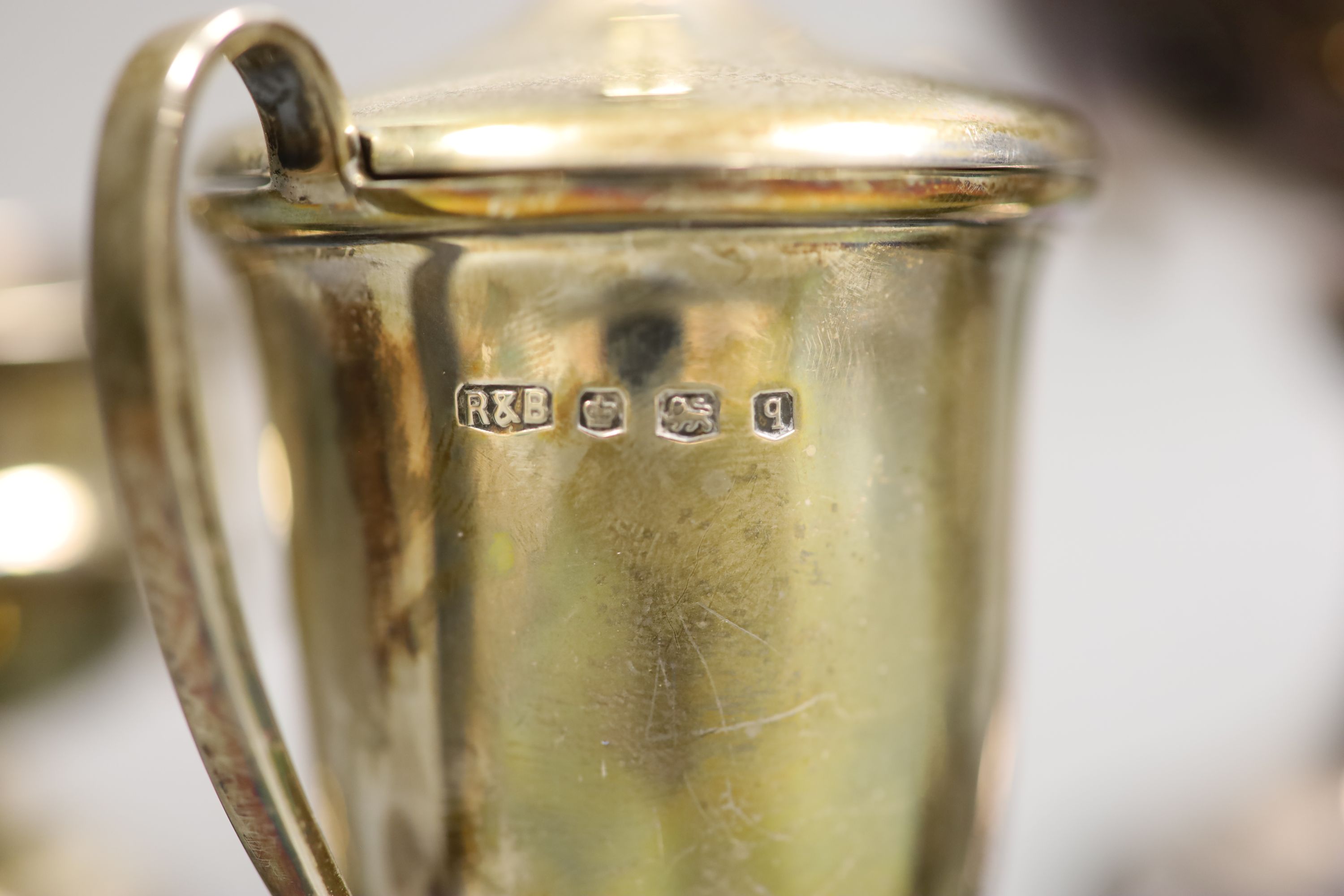 A collection of five small silver presentation trophy cups